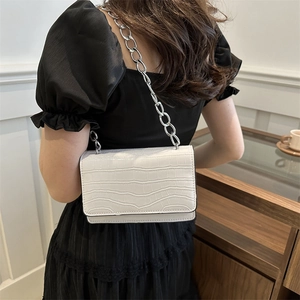 Modern white crocodile pattern crossbody bag with stylish silver chain strap for women