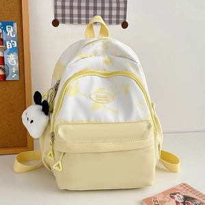 Detail of minimalist nylon backpack in yellow and white with soft cloud texture