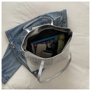 Silver metallic crocodile pattern tote bag showing high storage capacity for tablet and items
