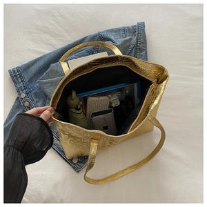 Top view of large gold crocodile pattern tote bag showing spacious inner storage capacity