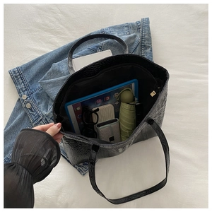 Top view of large black crocodile pattern tote bag showing spacious interior storage