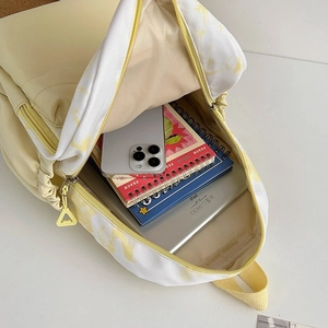 Top view detail of nylon backpack main compartment showing high capacity for tablets and books