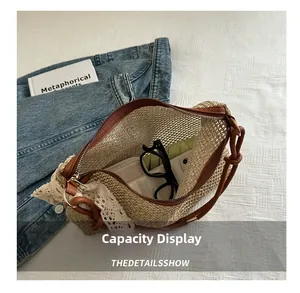 Detail view of large capacity straw bag interior showing daily items on white background