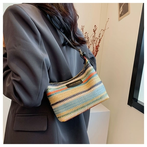 Detail of colorful rainbow woven shoulder bag with black leather Fashion Bags tag