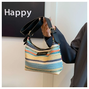 Detail of colorful rainbow woven shoulder bag featuring a Fashion Bags leather tag