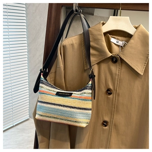 Close-up of rainbow woven texture and fashion bags leather label on the shoulder bag