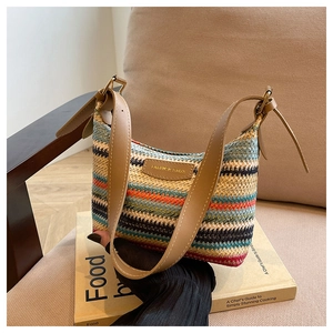Detail of colorful rainbow woven texture shoulder bag with premium brown leather strap