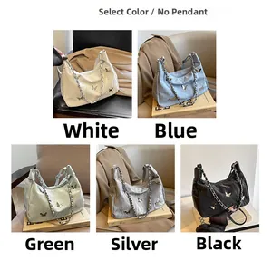 Flat lay of five colorful butterfly tote bags with chain straps in multiple color options