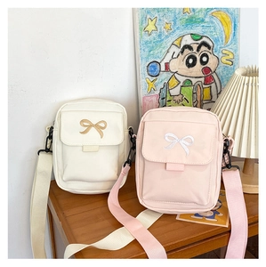 Mini canvas crossbody bags in beige and pink with cute bow embroidery detail