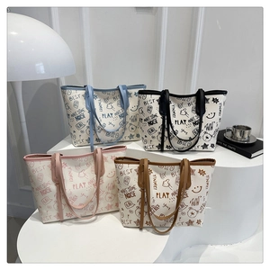 Group display of graffiti printed tote bags in four colors with cute cartoon patterns