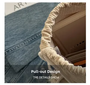 Detail shot of beige corduroy drawstring closure showing interior lining and capacity