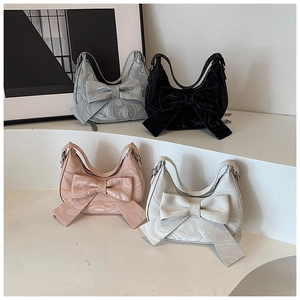 Collection of chic bow-decorated shoulder bags in marble and solid color textures