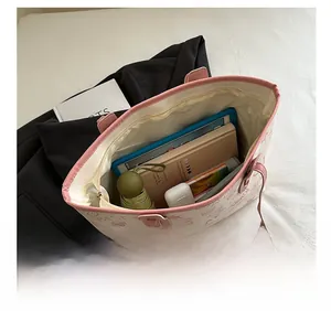 Detail showing high-capacity interior of this cute cartoon print tote bag with zipper