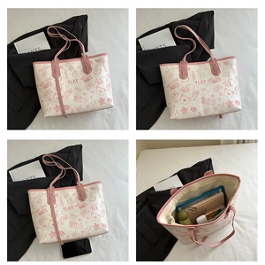 Detail view of a spacious tote bag interior holding a notebook and daily essentials