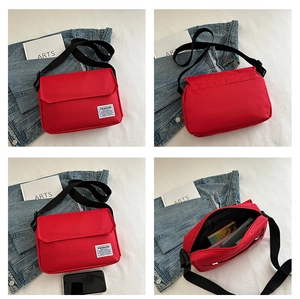 Detailed views of red oxford crossbody bag showing interior storage and compact square design