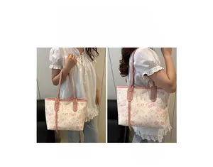 Contrast color tote bag with cute cartoon prints showing handheld and shoulder carry modes