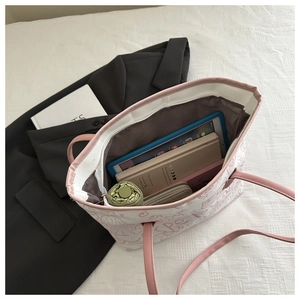 Top view of large graffiti canvas tote showing spacious interior for tablet and books