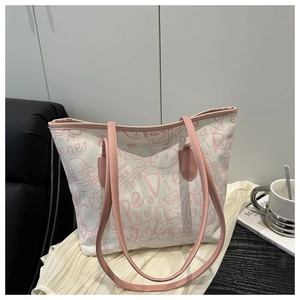 Detailed view of large graffiti canvas tote bag with pink straps and cute cat drawings