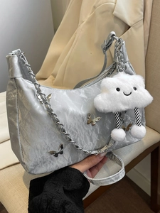 Silver butterfly tote bag with chain strap and plush cloud charm for stylish daily commute