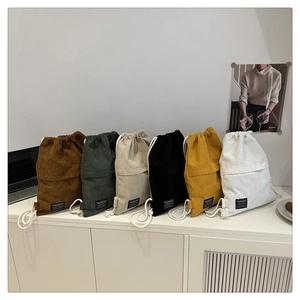 Detailed display of corduroy drawstring backpacks in six various colors for casual style