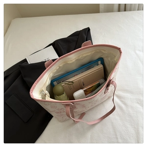 Top view of pink and white canvas tote bag showing spacious interior with daily essentials