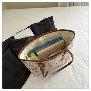 Interior view of contrast graffiti tote bag showing large capacity for tablet and umbrella