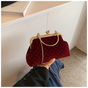 Chic burgundy velvet shell bag with white polka dots and gold metal hardware clasp