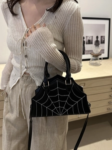 Chic black handbag with spider web embroidery and wavy edge detail for daily use