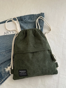 Minimalist dark green corduroy drawstring backpack with Fashion Instinct patch embroidery