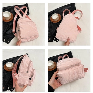Pink crinkled mini backpack showing front, back and side views with adjustable straps