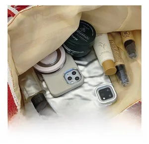 Top view of striped tote bag interior showing large capacity for gadgets and cosmetics