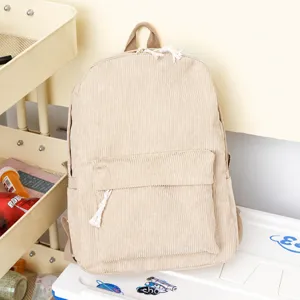 Detail of beige corduroy backpack texture with zipper pocket and cotton rope puller