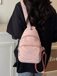 Pink multi-pocket chest bag in crinkle fabric with adjustable strap for women