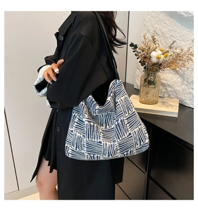 Detail showing the blue and white geometric woven texture of this large tote bag