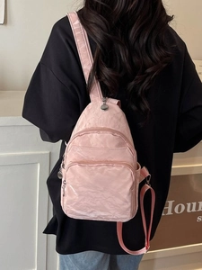 Pink pleated minimalist crossbody chest bag for women with adjustable straps and multi-zippers