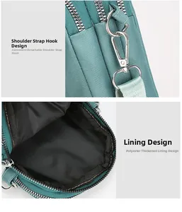 Detail of the dark green nylon phone bag featuring durable double metal zippers and hooks