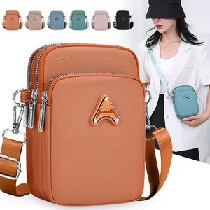 Detail view of the multi-layer zipper crossbody phone bag with various color options