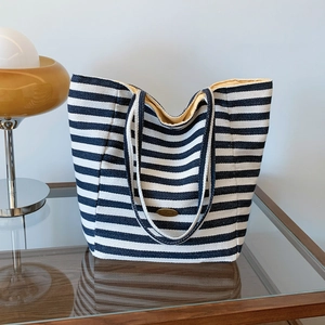 Classic large striped tote bag with yellow lining and metal handmade plaque detail