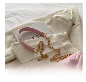 Close-up of pink quilted chain bag featuring V-shape stitching and a comfortable strap