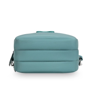 Detailed bottom view of blue nylon crossbody bag featuring three main zipper compartments