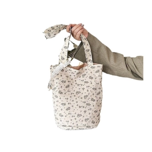 Floral print cloth tote bag with white lace trim and elegant jacquard fabric texture