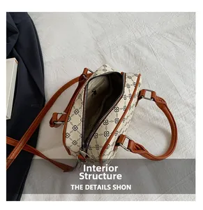 Internal view of retro cream crossbody bag showing zipper pocket and spacious lining