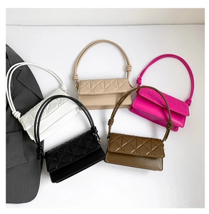 Flat lay of five quilted shoulder bags in neutral and vibrant colors with knotted straps