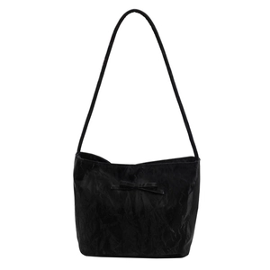 Minimalist black leather tote bag with bow detail and large capacity shoulder strap