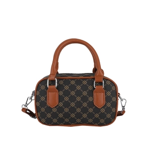 Chic vintage monogram square handbag with brown leather handles and silver hardware