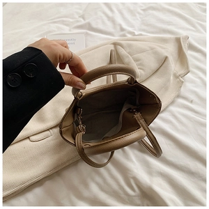 Top view of brown lychee grain leather tote bag showing spacious interior and soft lining
