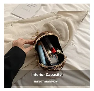 Detail view of round leopard print crossbody bag showing spacious interior capacity