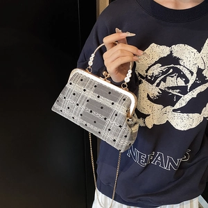 Vintage-style gray mesh shell bag with pearl handle, black dots and lace details