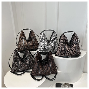 Detailed display of fashionable leopard print tote bags in diverse stylish colors