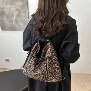 Large leopard print backpack for women with decorative bows and side zippers